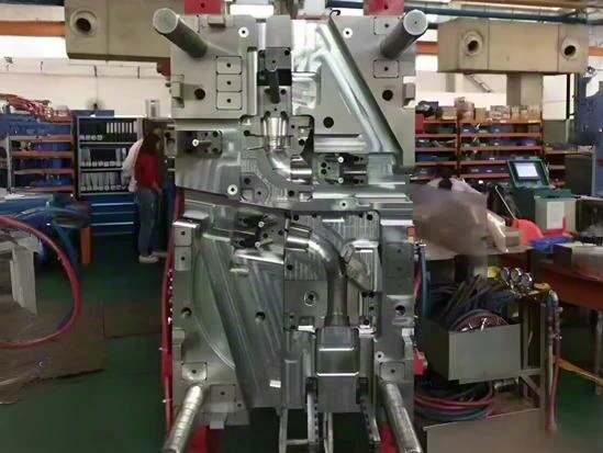 Large injection mold lifted for robotics automation