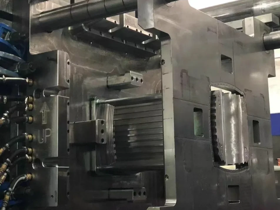 High-tonnage injection mold mounted in press for aerospace parts